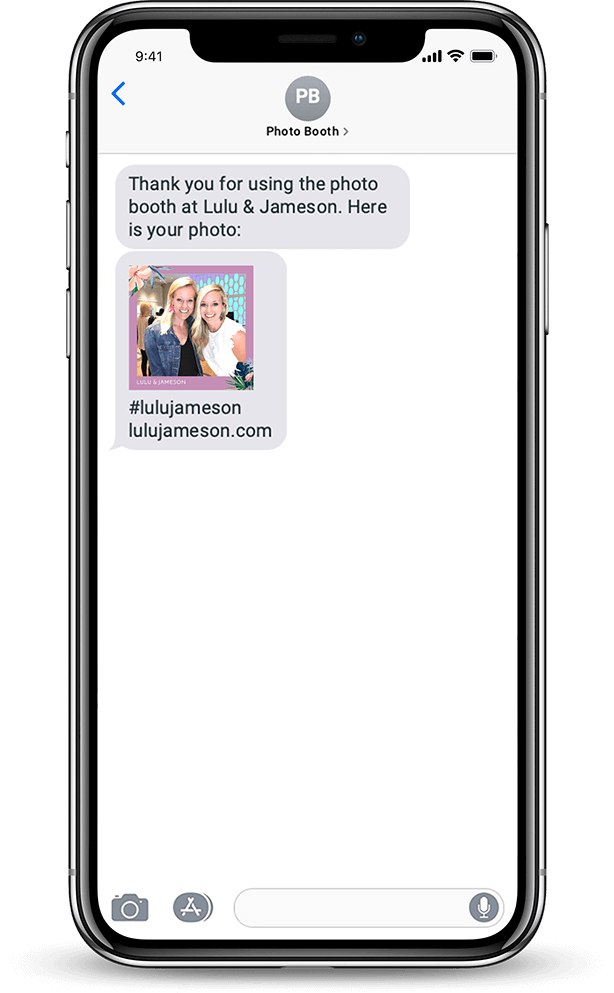 An iPhone 11 showing a text from an In-House Photo Booth